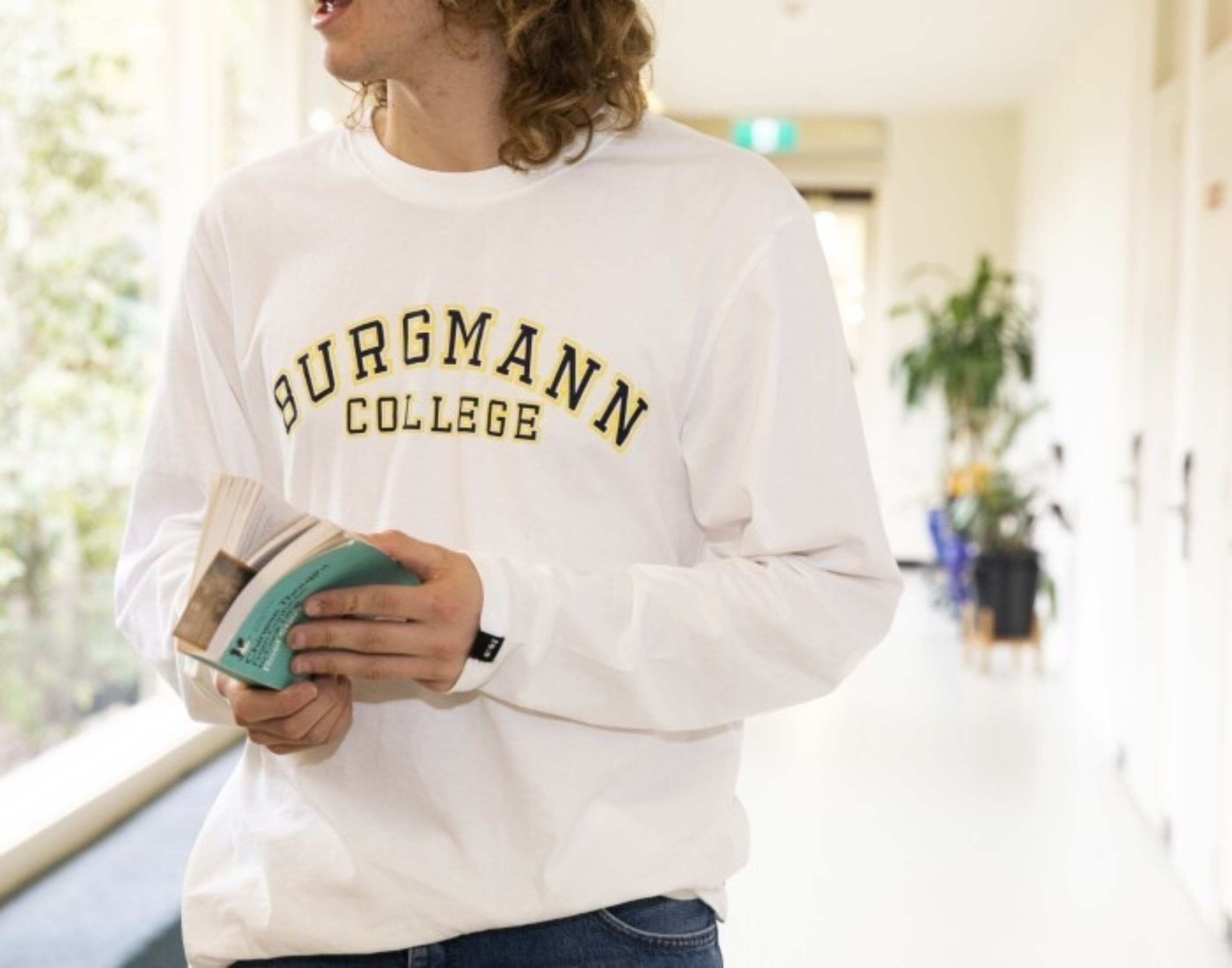 Burgmann resident holding book website